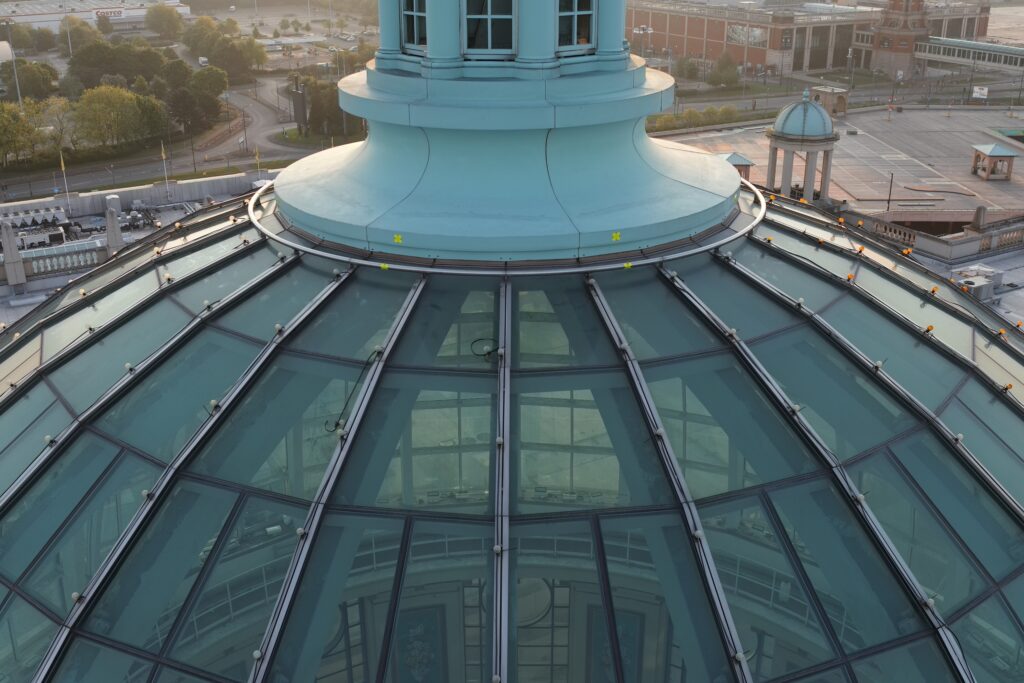Drone roof inspection of glass dome and cupola showing glazing panels and fixings