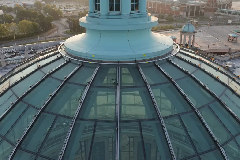 Drone roof inspection of glass dome and cupola showing glazing panels and fixings