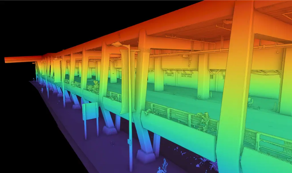 3D laser scanning point cloud of a multi-storey car park, coloured by height, showing structural columns, beams and exposed services